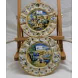 Pair of Fiance Ware Plates, with scalloped borders, cupids the foreground of lakes, each 10” dia