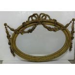 Late 19thC Gilt framed Oval Wall Mirror with decorative swags