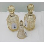Pair of cut glass perfume bottles with silver ps & a similar smaller perfume bottle (3)