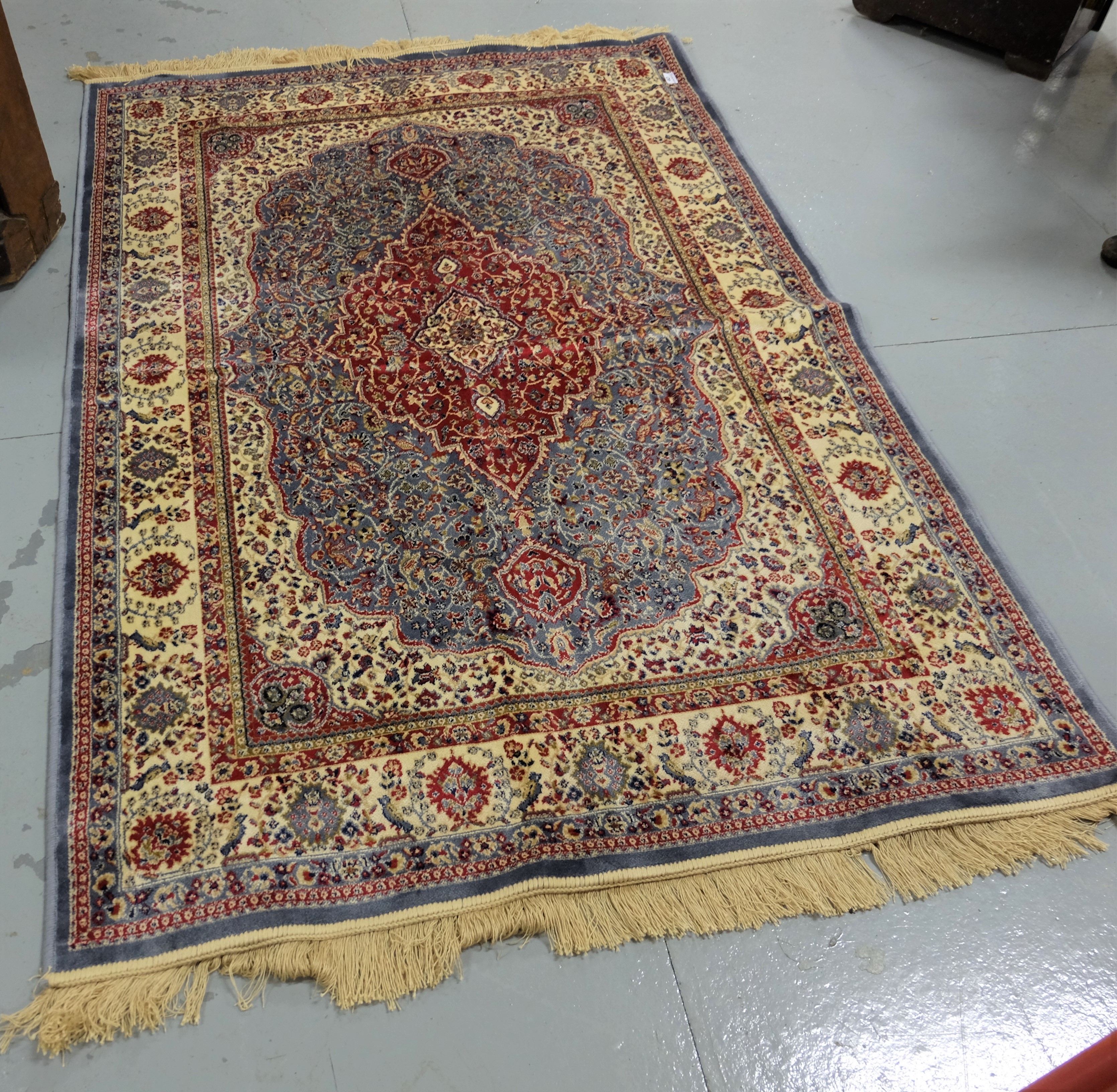 Duck egg blue ground Kashmir Floor Rug with an all over floral pattern and unique red medallion, 1.