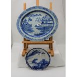 2 blue and white plates – 1 oval (chip rim) & 1 circular with garden scene (9.5” dia)