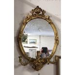 19thC Giltwood Wall Mirror with 3 carved sconces, in an ornate carved frame, 36”h