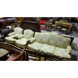 Three Piece Sitting Room Suite – a couch and pair of armchairs, on sabre legs, beige floral fabric