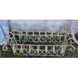 Pair of wrought iron planters, scrolled finials, each 47”w