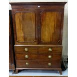 Georgian Mahogany Gents Linen Press, with a dentil cornice, over two doors opening 5 sliding