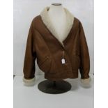 Lady’s Sheepskin Coat, brown leather outer with an Icelandic lambskin shearling lining, by Conder of