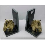 Pair of green marble bookends, each mounted with a cast brass model of horses head, each 8”h