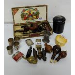 Assorted shelf of items – carved tobacco pipes, 4 whistles, match striker & lighters, 4 measures, 2