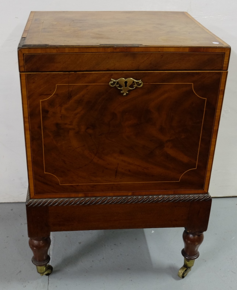 Georgian Mahogany wine cooler, square shaped and inlaid top, opening fitted compartment, brass