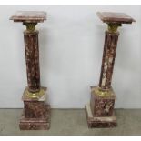 Matching Pair of Red Marble Torcheres with brass Corinthian column detail, 39”h x 10” sq p