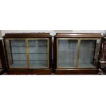 Fine quality 1950s mahogany display cabinet, the graduated top over 2 brass framed doors
