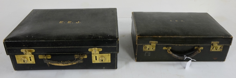 Similar pair of black leather cased doctor’s satchels with French brass lever clasps (2)