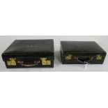 Similar pair of black leather cased doctor’s satchels with French brass lever clasps (2)