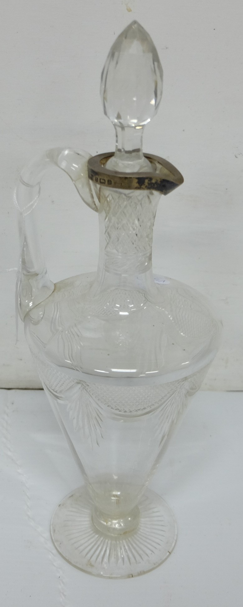 Cut glass urn shaped ewer with solid silver rim and original cut glass stopper, 14"h