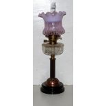 Victorian Table Oil Lamp, brass base, clear glass bowl and a tulip shaped purple and pink shade, 26.