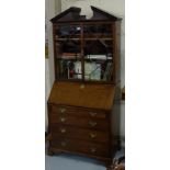 19thC Mahogany Bureau Bookcase, the arched pediment over two glazed doors enclosing shelves and a