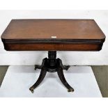 Regency mahogany fold over card table with a reeded rim on a turned pod and 4 splayed legs, brass