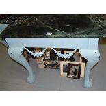 Matching pair of green marble topped console tables with painted green bases, ball and claw feet (1