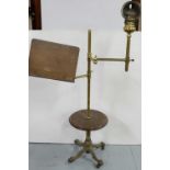 19thC Brass Adjustable Lectern, with attached oil lamp and a circular mahogany shelf and cast iron