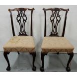 Matching pair of Mahogany side chairs, Chippendale style with ball and claw feet, pink padded seats