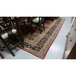 Persian Wool Floor Rug, red central ground with multiple navy ground borders, 2.8m x 3.6m