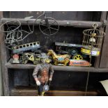 Shelf of old tin toys & a Tudor man (all damaged)