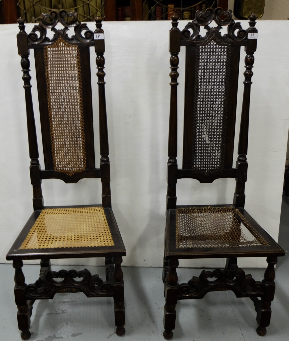 Matching pair of carved oak highback hall chairs, bergere seats and backs (one seat damaged)