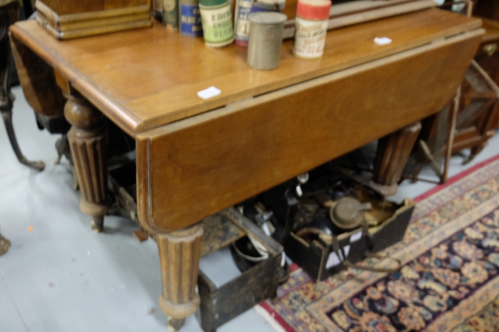 Victorian mahogany drop leaf table on turned and reeded legs, 44"w, extends 43" long