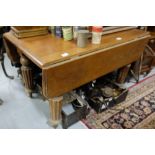 Victorian mahogany drop leaf table on turned and reeded legs, 44"w, extends 43" long