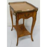 Kingwood Lamp Table with raised brass gallery, an apron drawer and stretcher shelve, sabre legs,