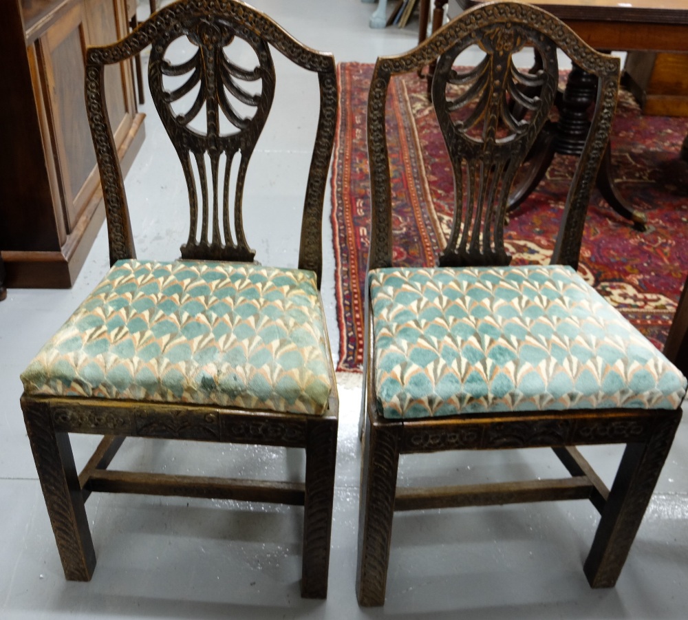 Matching set of 6 carved oak dining chairs with splat backs, square legs with impressed designs
