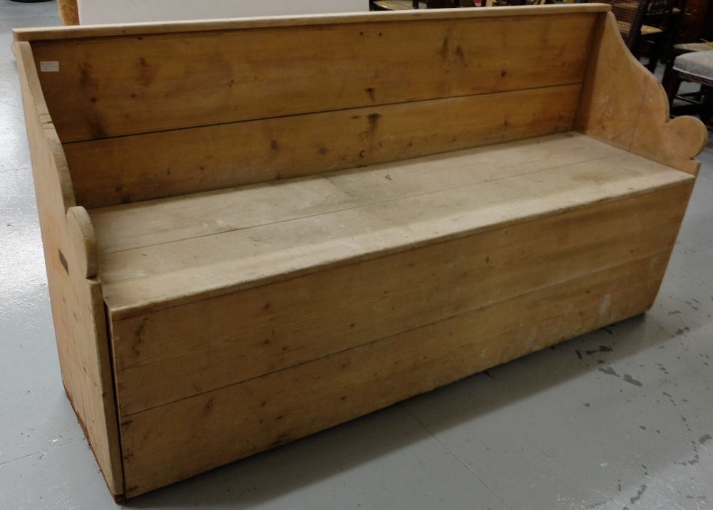 Irish antique pine settle bed, with curved side arms and drop- down front panel, 72"w x 35"h x 20"d