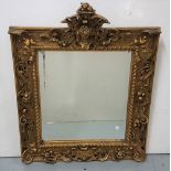 Carved gilt wood rectangular shaped wall mirror, the upper pediment featuring whippet heads and a