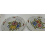 Matching pair of circular Italian painted floral pottery wall plates, early 20th C, 14"dia
