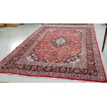 Red ground Persian Kashan Carpet, with a traditional Kashan design, multi-coloured 2.93 m x 2.02 m