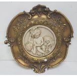 Cupid Group in an ornate gilt frame, 35cm dia