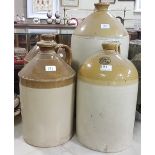 4 large Stoneware Whiskey Jars, 17”h to 22”h (1 with hair cracks)