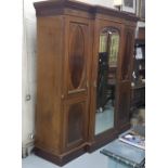 19th C 3 door mahogany wardrobe, a Greek dental moulded top over 2 panelled doors enclosing a