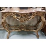 Louis IV style carved gilt console table, with a red marble serpentine top, decorated with