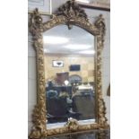 Matching Pair of carved gilt pier wood wall mirrors with foliate carved pediment and decorative