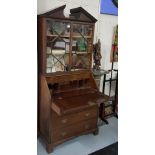 19thC Mahogany Bureau Bookcase, the arched pediment over two glazed doors enclosing shelves and a