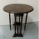 Chinoiserie Sutherland Table with bobbin shaped legs, with raised floral patterns, 22" d, extends to