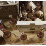 Box of “Bells” whiskey advertising bottles & 2 large glass wine distilling bottles (1 cracked)