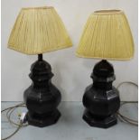 Pair of Stifel Table Lamps (electric), brass base, painted black, cream silk shades, 23”h