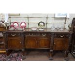 Fine quality Irish mahogany sideboard, c1920, a polished double rail back brass gallery over the