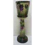 Late 19thC German Porcelain Jardindere, green ground with purple wisteria, on a matching column,