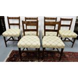 6 similar Edwardian dining chairs, padded seats covered with cream ground and rosettes, tapered legs