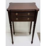 Regency style side table or bedside table with two drawers standing on slender turned legs with