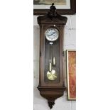 Single Weight Vienna Wall Clock, in a decorative walnut case, 49”h