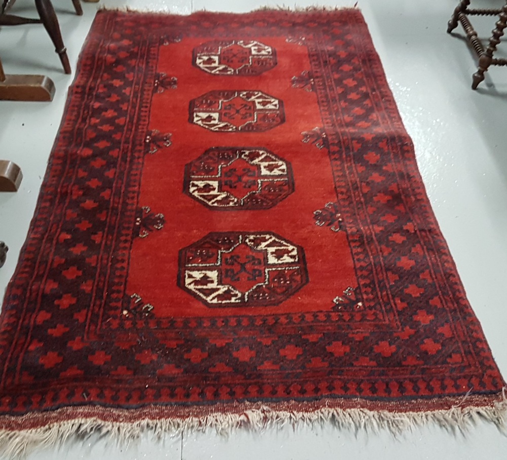 Persian wool ground red rug, bacarra pattern on a woollen back, 1.85m x 1.05m